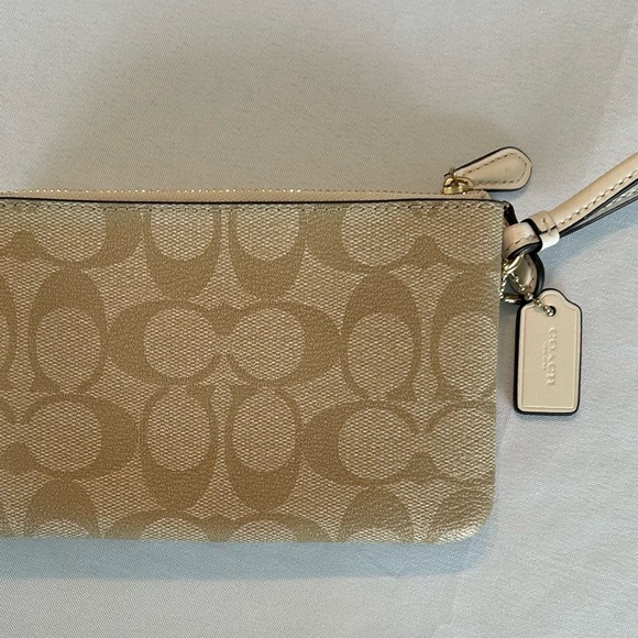Coach Signature Double Zipper Wristlet in Tan and White with gold trim. - Picture 4 of 5